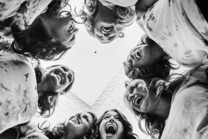Group of people smiling & hugging